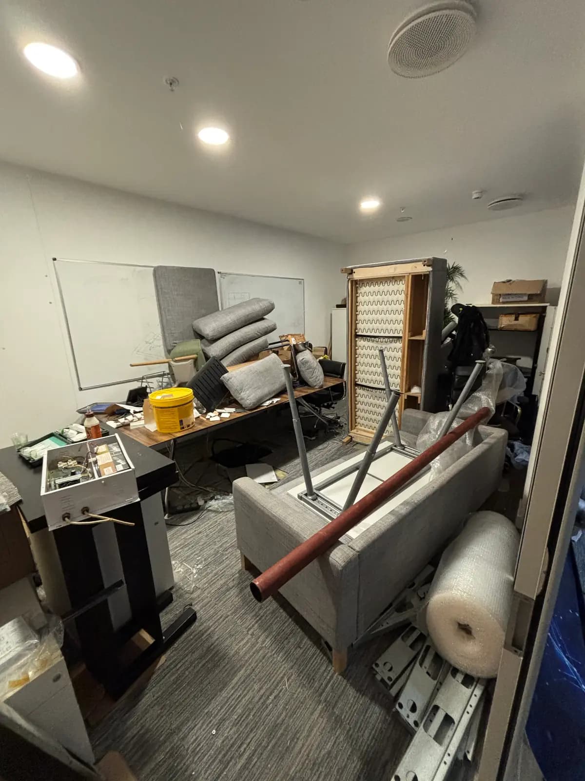 Before office strip-out waste removal — cluttered space