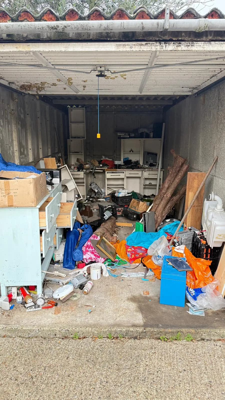 Before garage clearance waste removal — cluttered space
