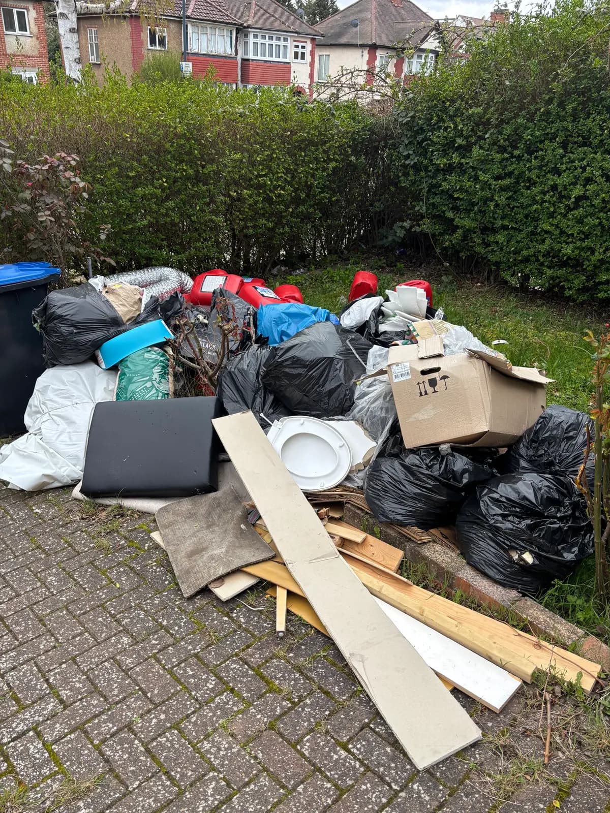 Before garden clearance waste removal — cluttered space